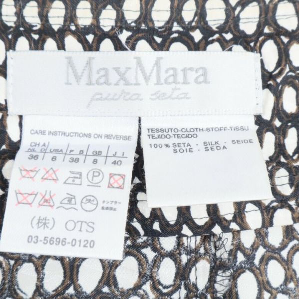 MaxMara etikett med materialinformation 100% silke