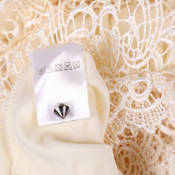 Materialetikett med tvättråd och innehållsinfo