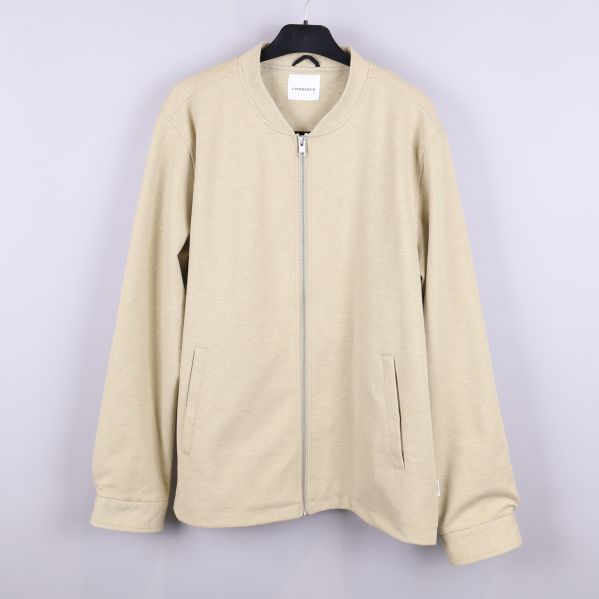 Beige jacka med dragkedja framifrån