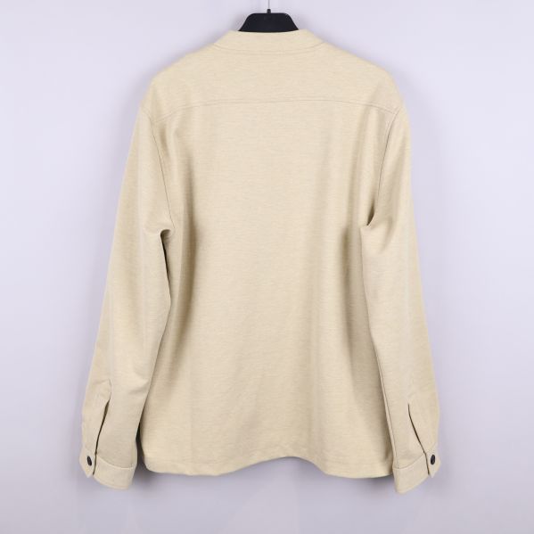 Beige jacka visad från baksidan