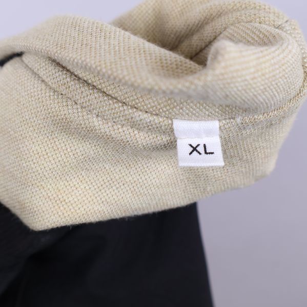 Storlekslapp XL på jackans insida