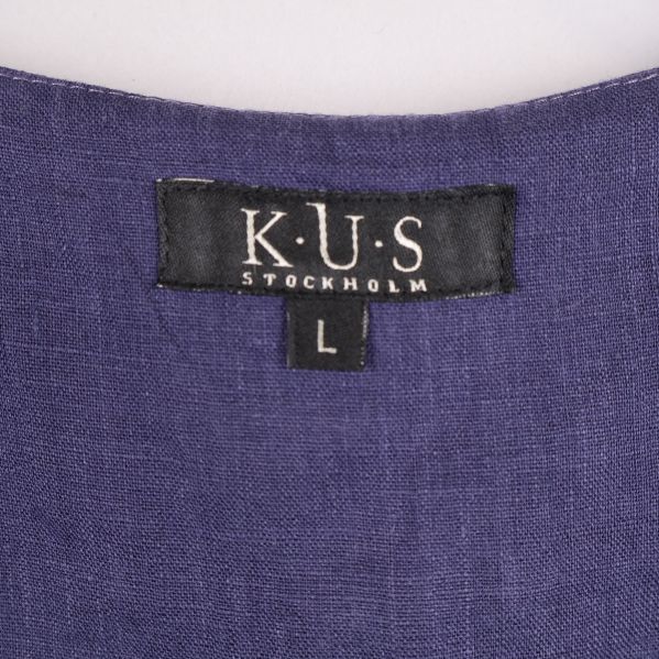 K.U.S Stockholm etikett på blusens insida