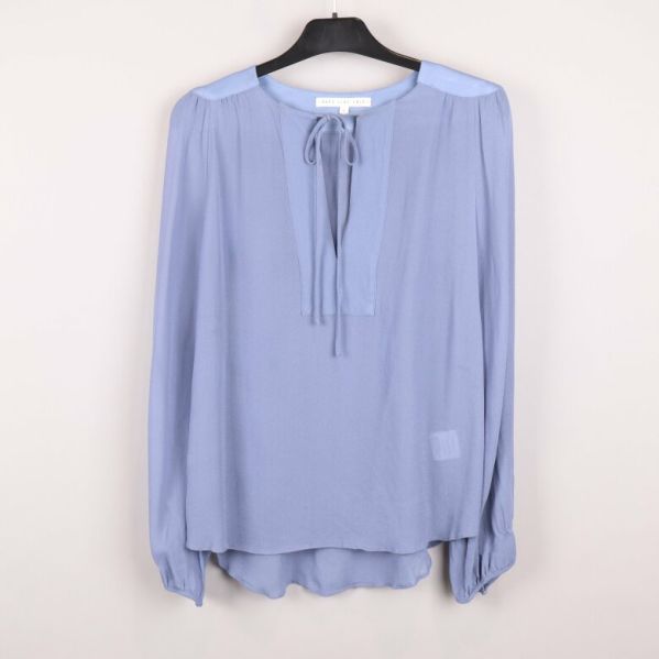Blå blus med knytdetalj framtill