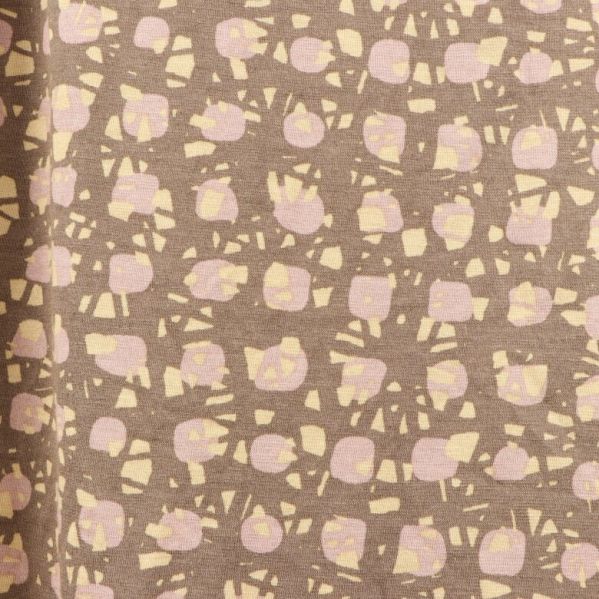 Detaljerat mönster i beige och rosa nyanser