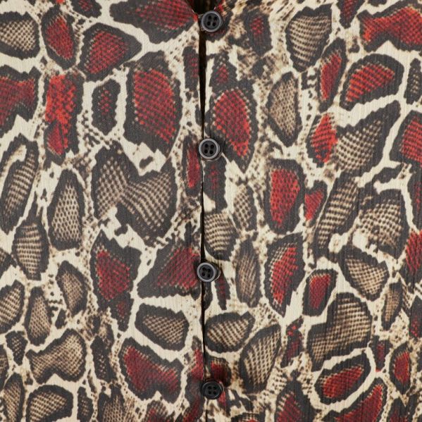 Knappar och mönster på klänningen