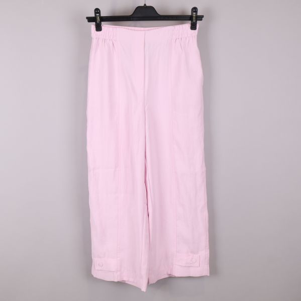 Framsidan av rosa byxor med breda ben och resårmidja