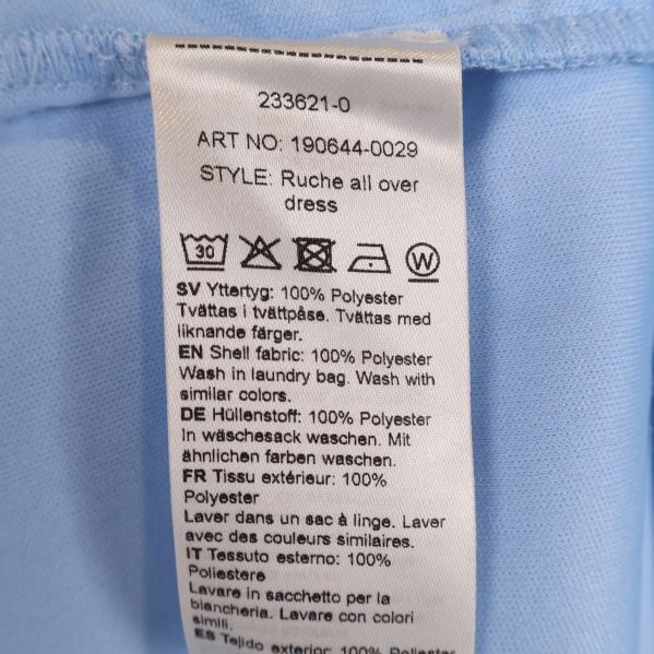 Materialetikett visar 100% polyester
