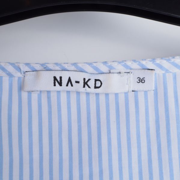 Etikett med NA-KD logotyp och storlek 36