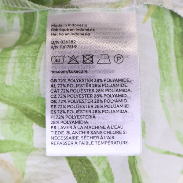 Materialtagg med tvättinstruktioner och sammansättning