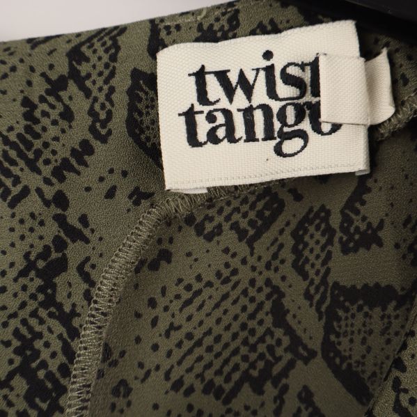 Närbild på twist & tango märket