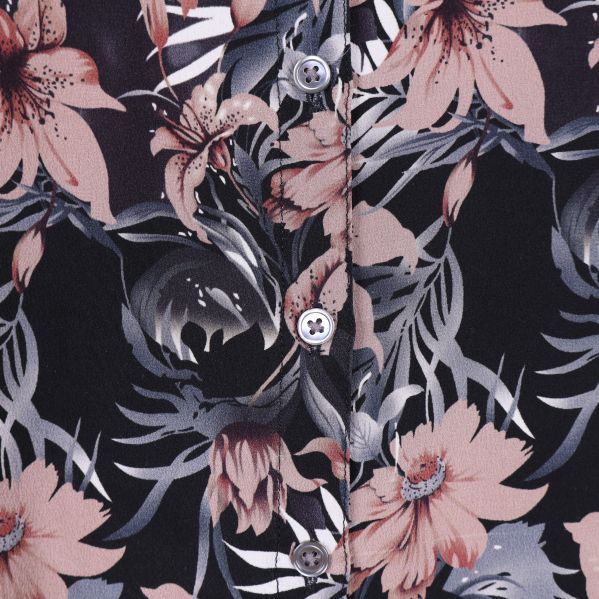 Detalj av blommönster och knappar fram