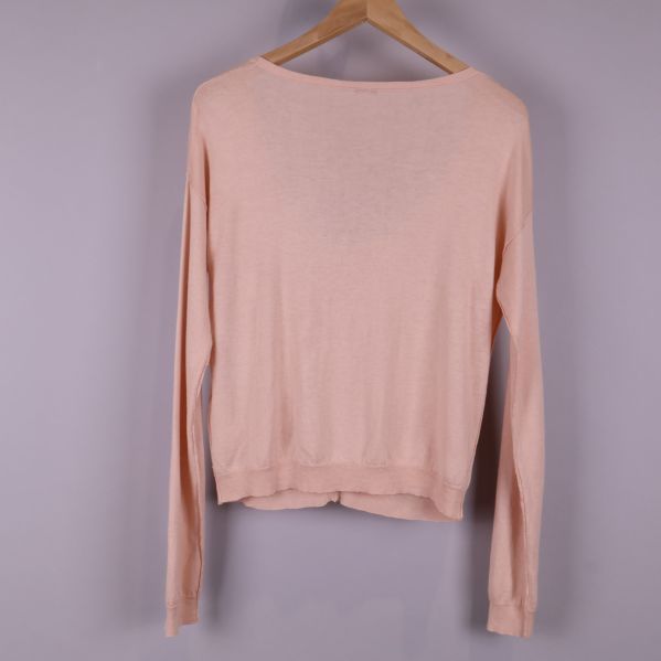 Baksidan av ljusrosa cardigan