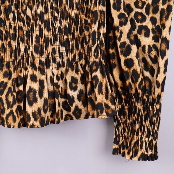 Nedersta delen av leopardmönstrad topp