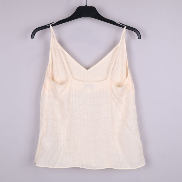 Baksida av ljus beige topp