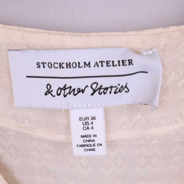 Varumärke & Other Stories etikett