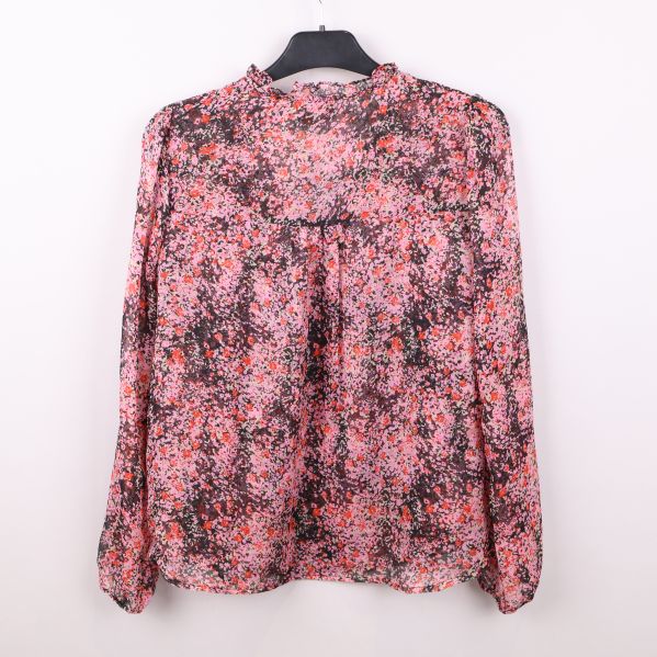 Blus med blommigt mönster, bakifrån