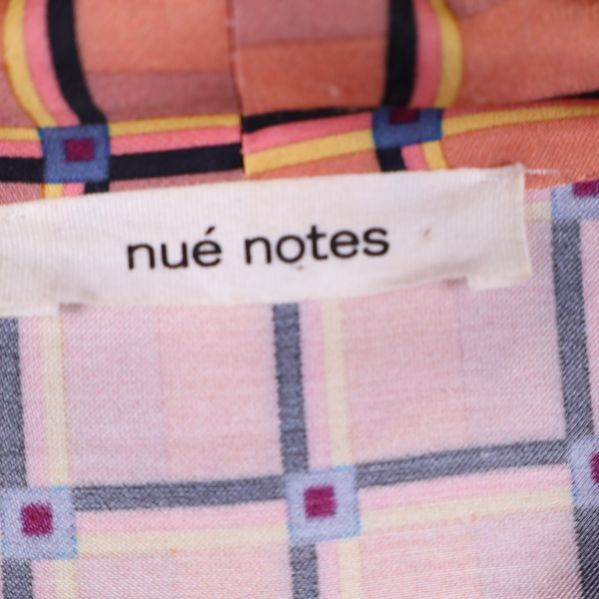 Nué Notes varumärke på etiketten