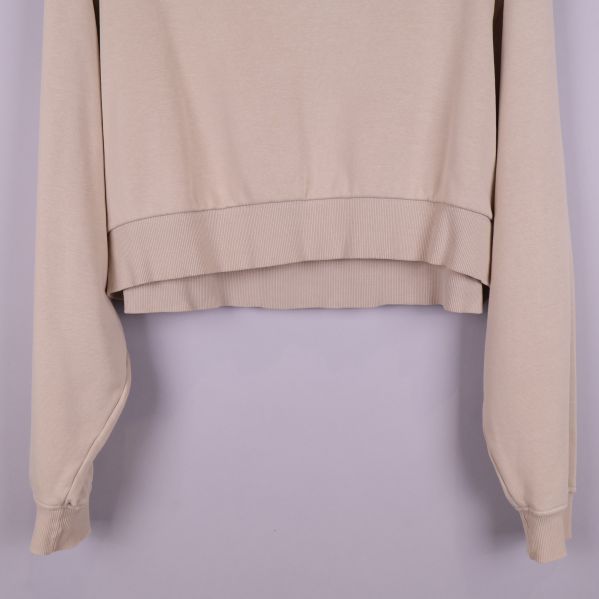 Nedre del av beige cropped tröja