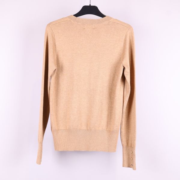 Beige tröja bakifrån