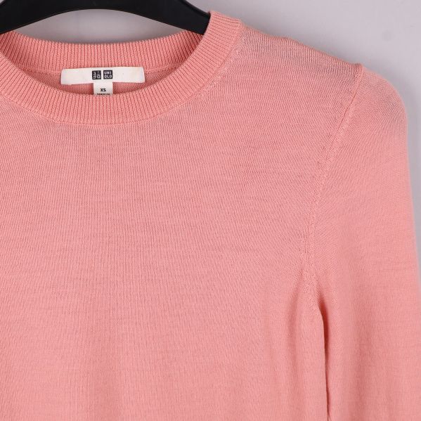 Närbild på rosa tröja texturen