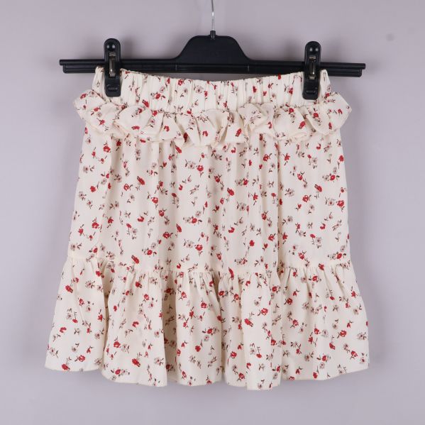 Kort blommig kjol med volanger