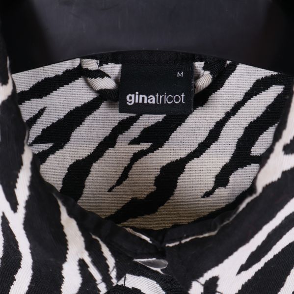 Gina Tricot etikett med storlek M