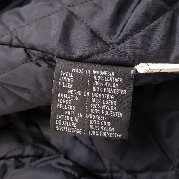 Materialetikett med information om läder och nylon