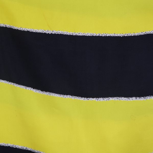 Närbild på gul och svart randig yta