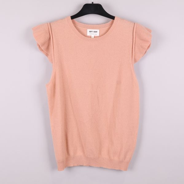 Ärmlös stickad väst med volang på axlarna framifrån