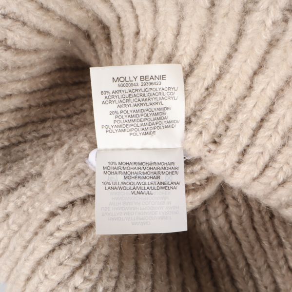 Materialetikett med information om ull och akrylfiber