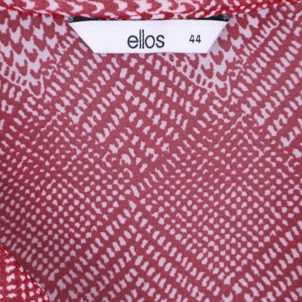 Ellos etikett och storlekslapp på insidan av tunikan