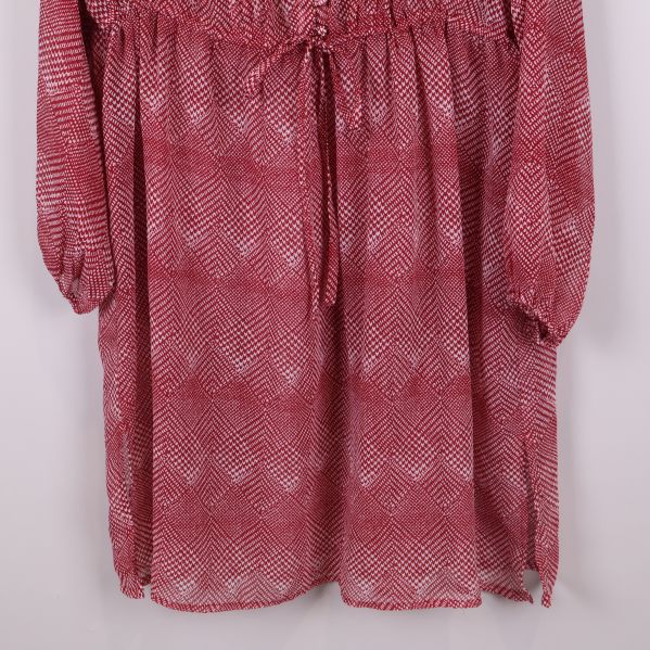 Nedre delen av tunikan med rynkad midja