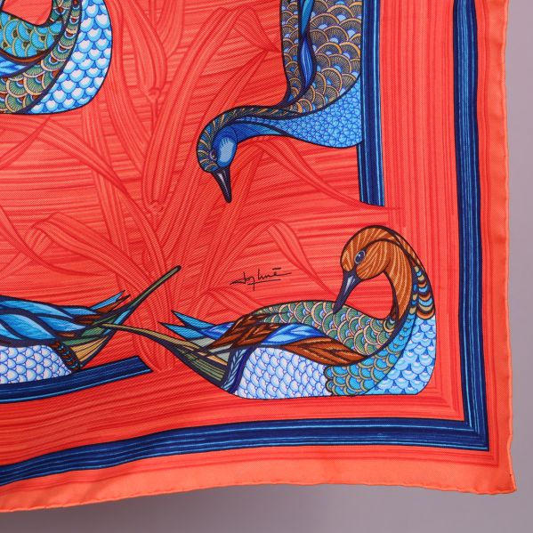 Signerad hörndesign med färgglad fågel