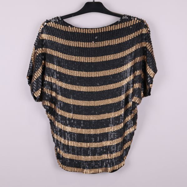 Baksida av topp med horisontella paljettränder i svart och brons