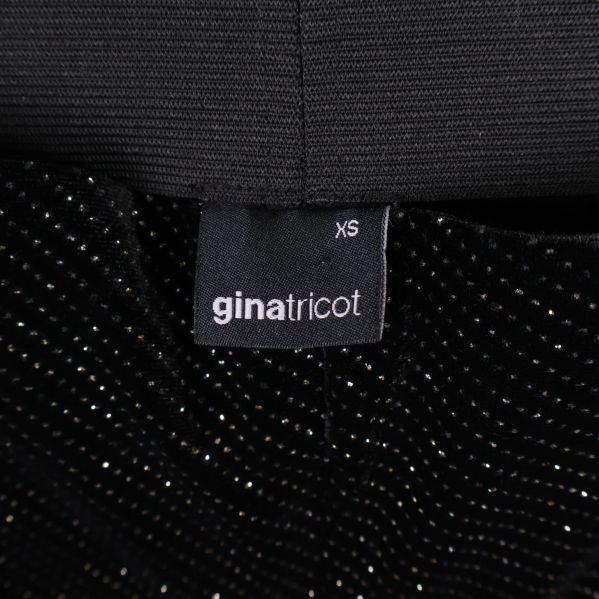 Varumärkesetikett gina tricot