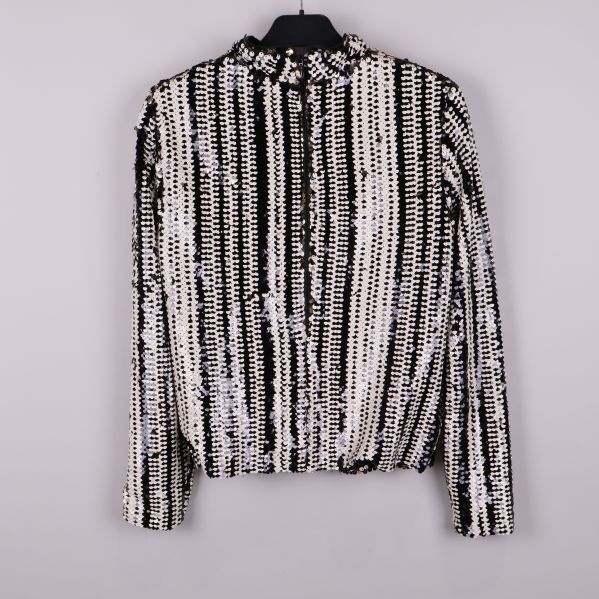 Paljettblus med svarta och vita ränder bakifrån