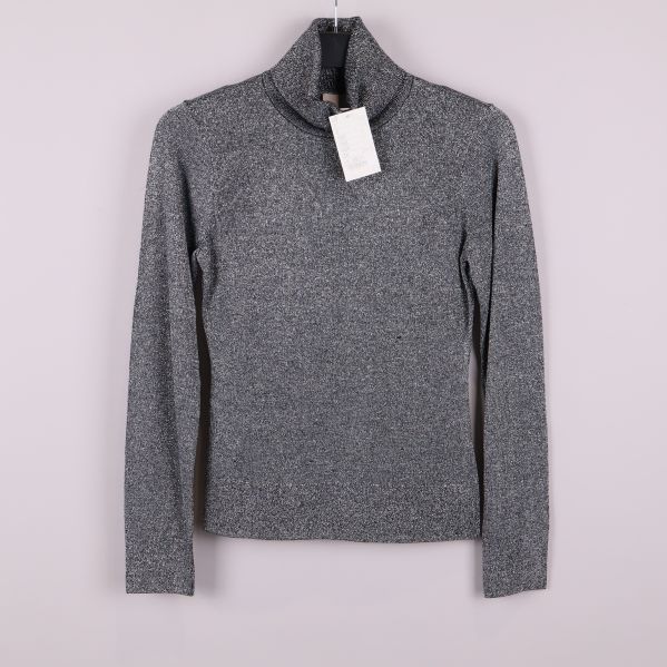 Glittrig silverfärgad polotröja med lång ärm framifrån