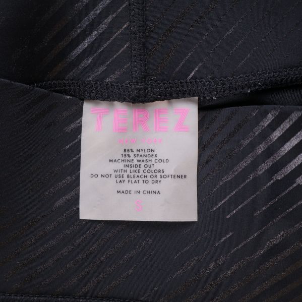 Materialetikett för Terez leggings med storlek och komposition