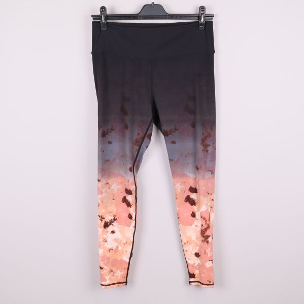Sporttights med mönster i svart och pastellfärger framifrån