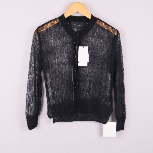 Svart transparent kofta på galge framifrån