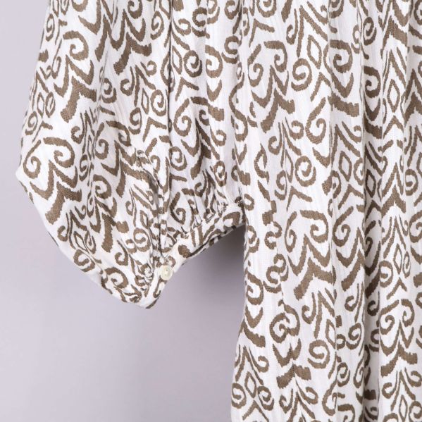 Ärm med knappdetalj