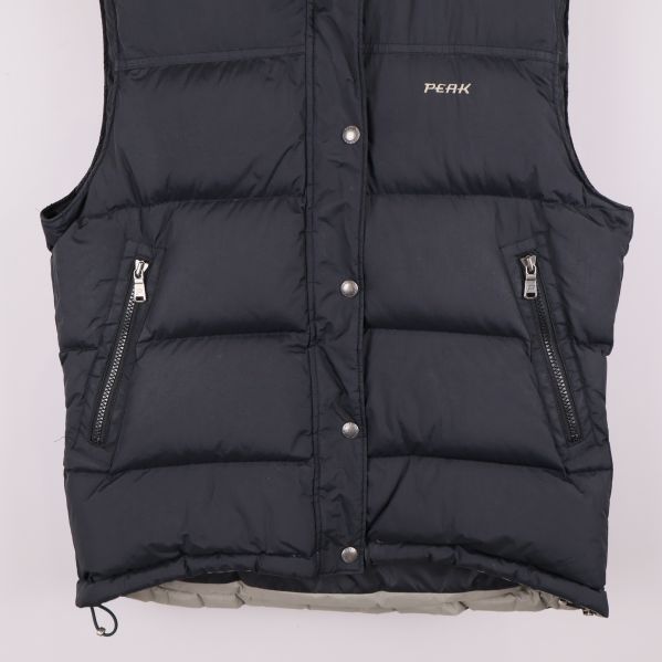 Nedre del av väst med blixtlåsfickor och dragsko i fållen