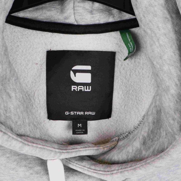Detaljbild på G-Star Raw etikett i huva på hoodie