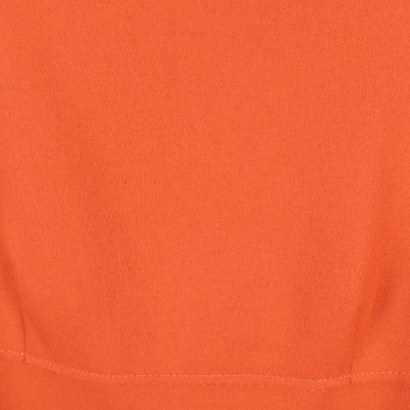 Närbild på slät orange textil utan mönster