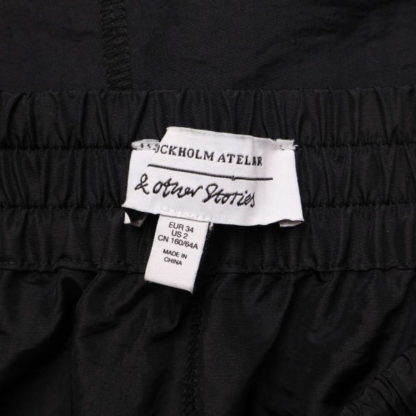 & Other Stories etikett