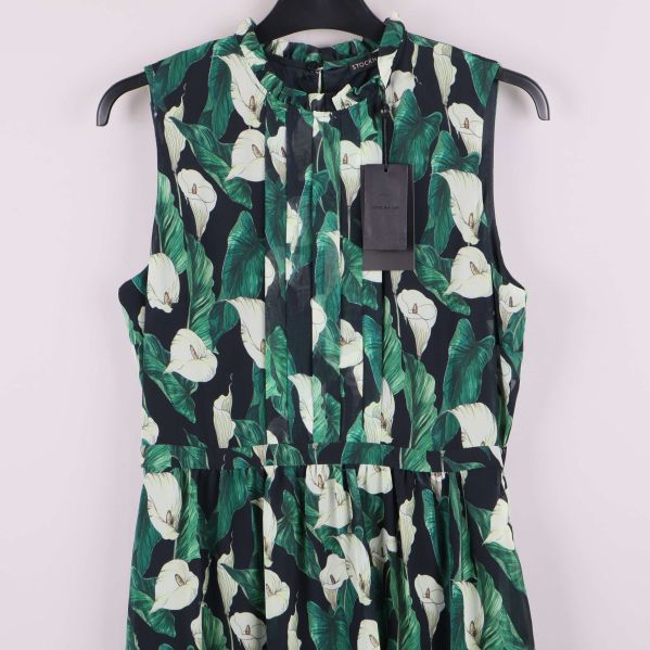 Övre del av klänning med knytning och bladmönster