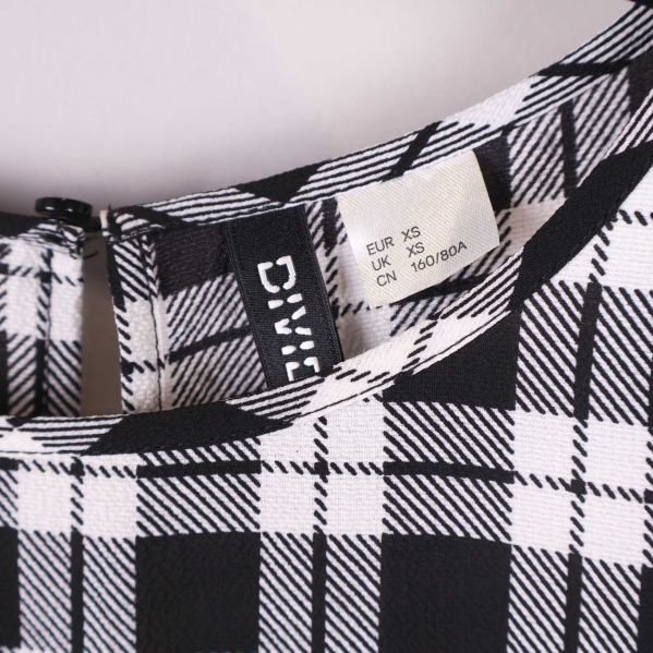 Storleksetikett på klänning