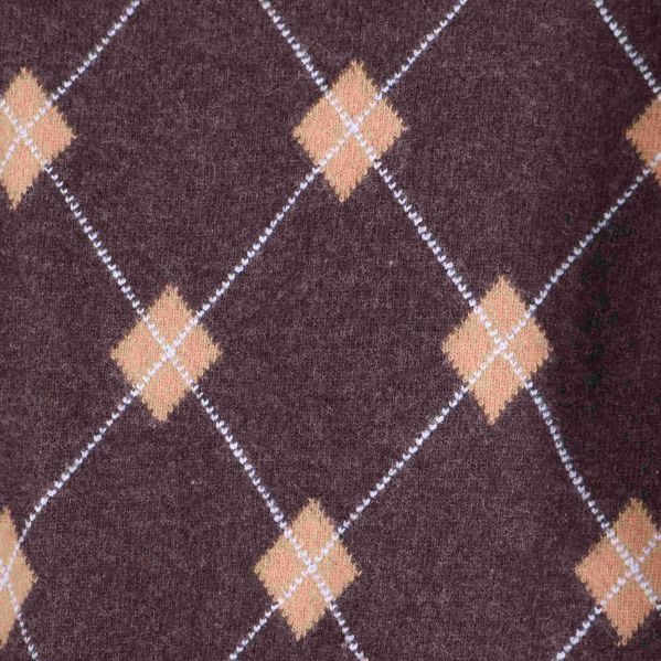 Närbild på argylemönster i brunt, beige och vitt