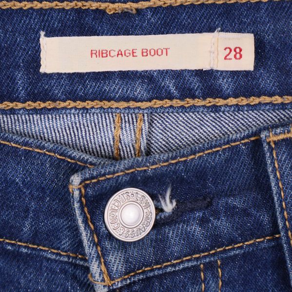 Inneretikett som visar ribcage boot och storlek 28