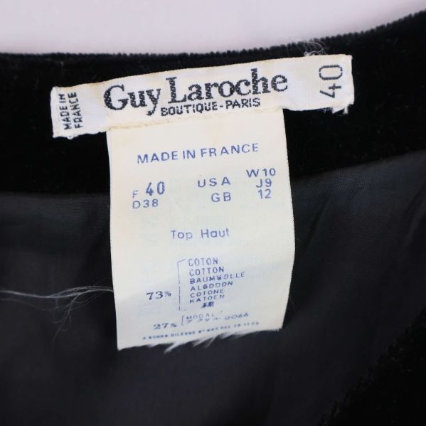 Närbild av etikett Guy Laroche och materialinfo